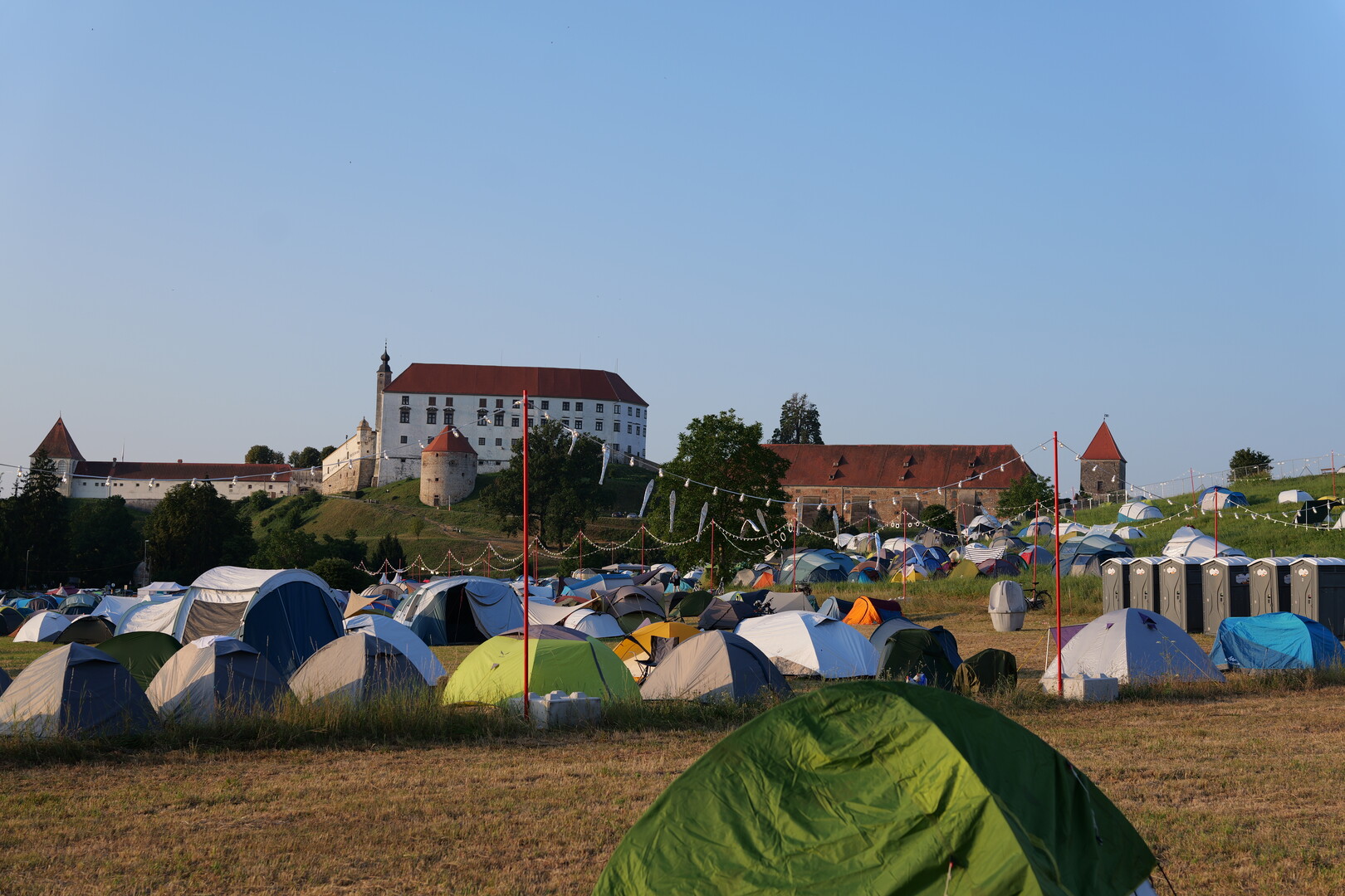 The campsite below the castle and a cloudless sky.